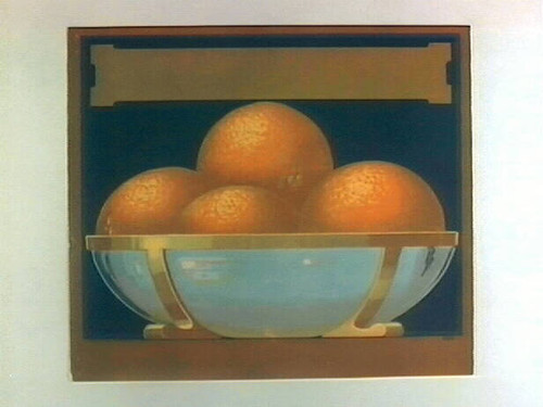 Stock label: glass and gold bowl of oranges