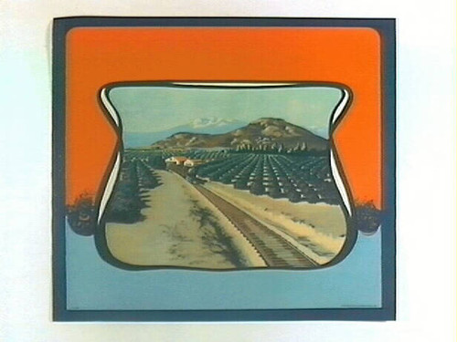 Stock label: Locomotive passing citrus groves