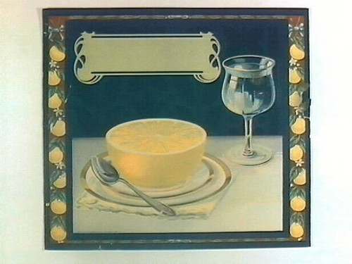 Stock label: grapefruit half on plate with spoon and wine glass of water