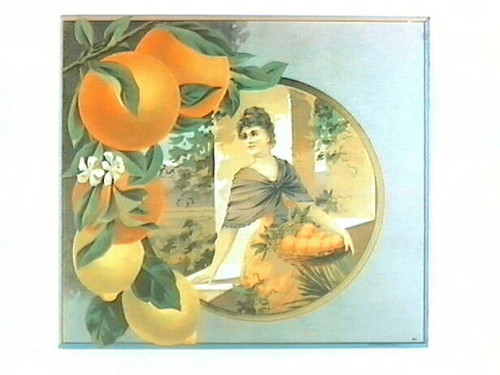 Stock label: oranges, lemons, and woman holding basket of oranges on balcony