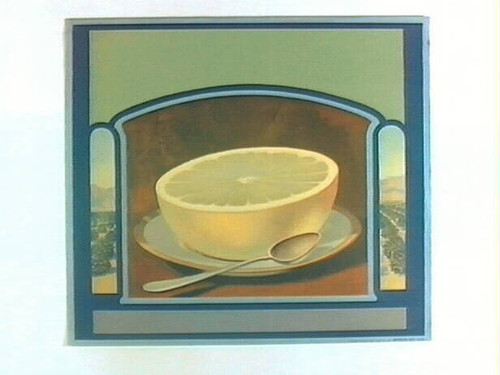 Stock label: Grapefruit half on plate with spoon