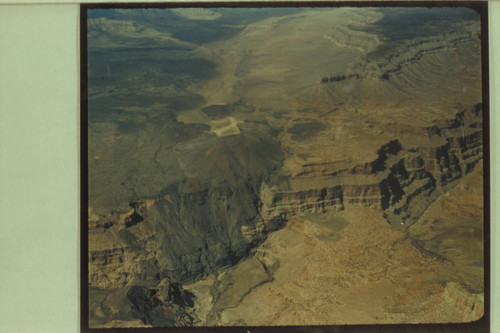 View up Toroweap Valley; Vulcans Throne at the edge of the Canyon. The head of Vulcan Rapid can be seen at the mouth of Prospect Canyon at lower left