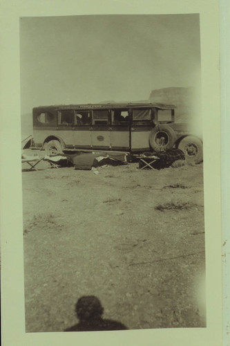 Bus and sleeping gear at Marble Canyon Bridge dedication. Print from Freeman collection