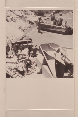 Wrecked motor in foreground, "Rattlesnake" in background. Repairs after capsize in Vulcan Rapid- Masland, Desloge and Atherton, approximately Mile 184 on the left bank