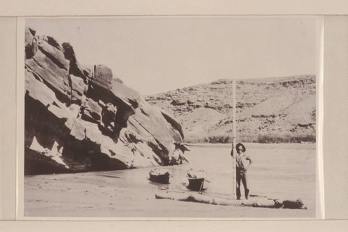 Point on San Juan half a mile north of mouth of Nokai Creek. Looking southeast across the river. DeChelly sandstone in left foreground. Shinarump conglomerate and terrace gravels in distance