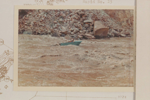 Harrris-Brennan boat at foot of Rapid 22, Cataract Canyon. The Sliced Boulder is at right. Compare its position with 64-4-1 CTCN 202-21