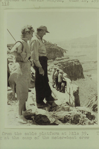 Bert Lucas points out to Margaret Marston the campsite of the motor crew in the bottom of Marble Canyon