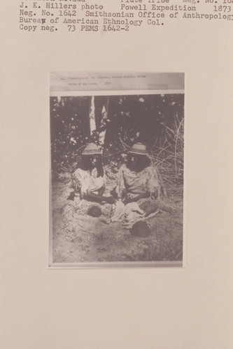 Jim-mi-pin-mi and Sika-whi cutting buckskin fringe. Valley of the Moapa, a tributary of the Rio Virgin in Southern Nevada. Piute Tribe. Powell Expedition, 1873