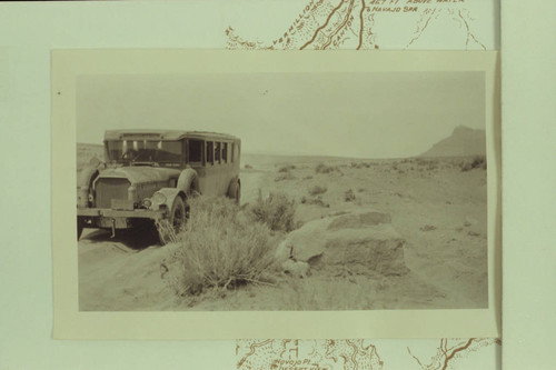 Bus on road between Cameron and the Navajo Bridge at time of the dedication of the Bridge. Print from Freeman collection