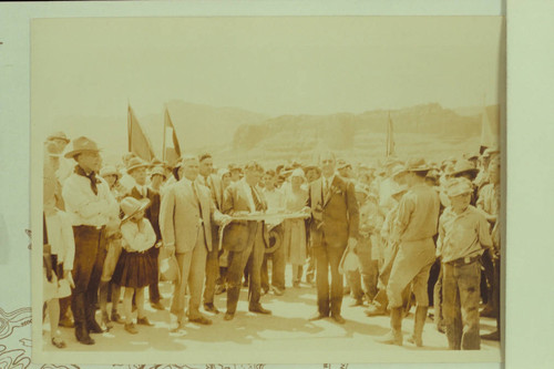 Cutting ribbon at dedication of Navajo Bridge. Freeman photo [Governors of New Mexico, Utah, Nevada, and Arizona]