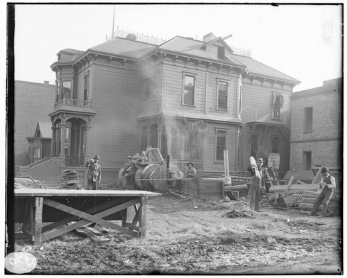 A construction crew working on the construction of the Fourth Street General Office Building