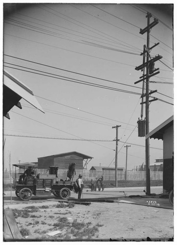 Raising transformer onto pole with electric truck