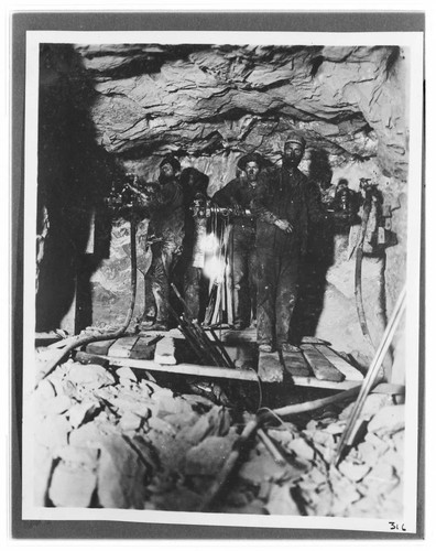 Miners working at the tunnel face at Kern River #1 Hydro Plant