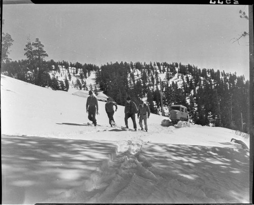 Big Creek snow survey. four men break snowshoe trail for Sno