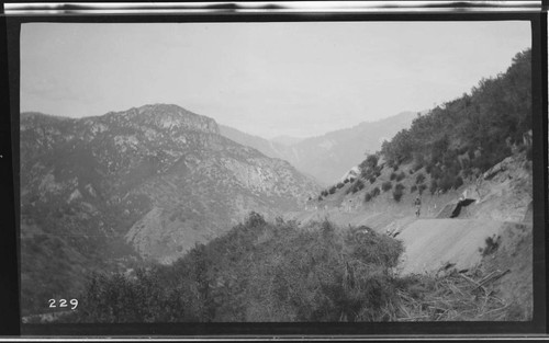 A man walking along the bench for the conduit at Kaweah #3 Hydro Plant