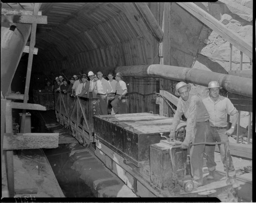 Big Creek tour group riding rail cars through the Big Creek Powerhouse #4 power tunnel