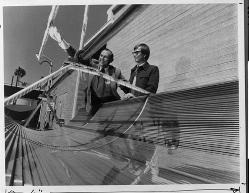 Edison engineers viewing an experimental solar trough