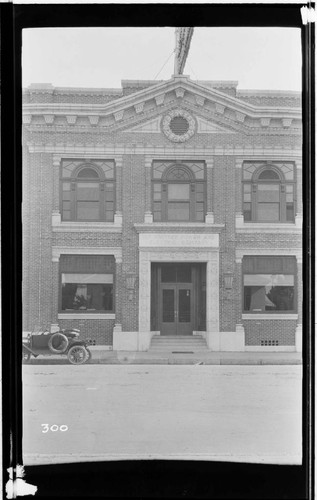 An automobile parked in front of the Visalia office building for the Mount Whitney Power and Electric Company