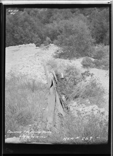 Sierra pipeline [penstock] showing pipe below tunnel in collapsed condition