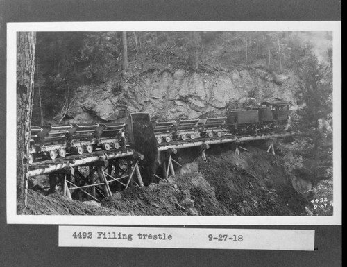 Filling trestle with railroad dump cars