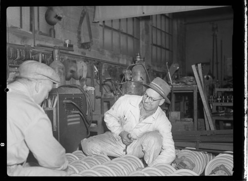 Two Men working with electric insulators