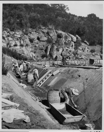 A repair crew repairing damage to the ditch carrying water to the Tule Hydro Plant, 1914