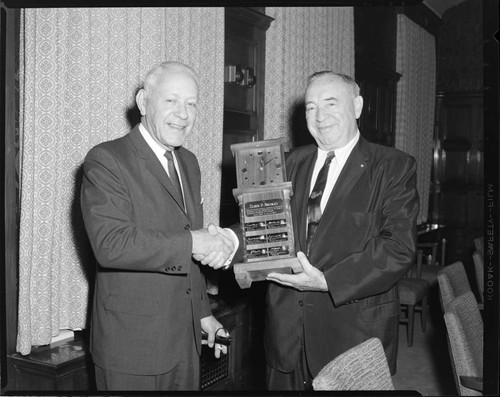 Harold Quinton gives award to Elmer P