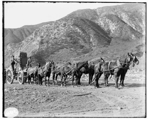 A team of horses hauling a transformer into Mill Creek #3 Hydro Plant