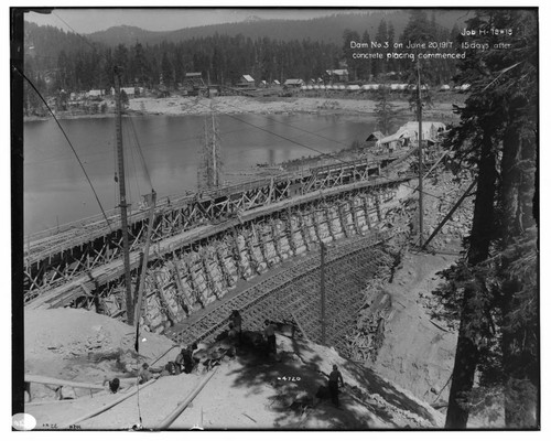 Big Creek Huntington Lake Dams - Dam #3, 15 days after concrete placement commenced. [Background shows gravel plant and construction camp housing across the lake.] Job H