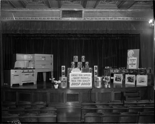 Display of commercial restaurant cooking equipment and food products on the stage the G