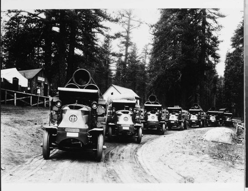 These Mack "Bulldog" trucks are posed at the foot of the Kaiser Pass road at Huntington Lake in 1927