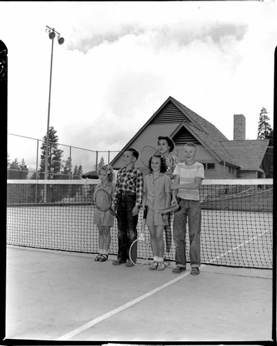 Group shot of four kids and instructor on Big Creek tennis court