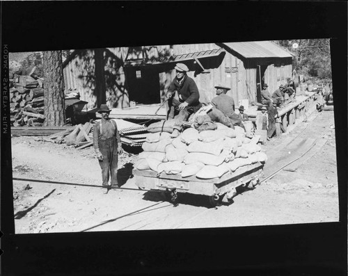 Tramway hauling bags of cement up to Agnew Lake and Gem Lake dam construction sites