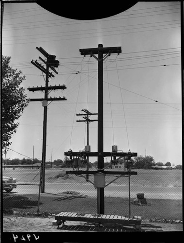 Distribution poles and equipment at substation(?)