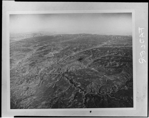 High elevation aerial photo of desert habitat, with a large river running through it