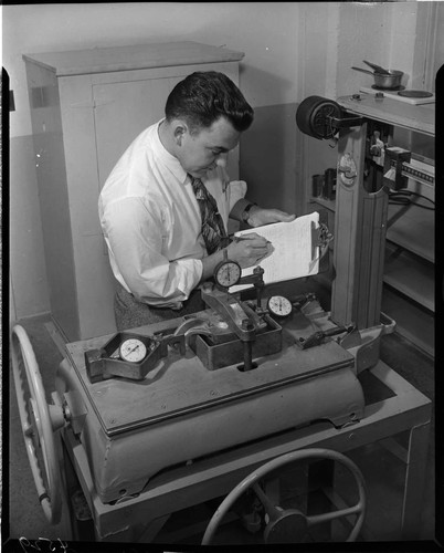 Man testing a device on a scale