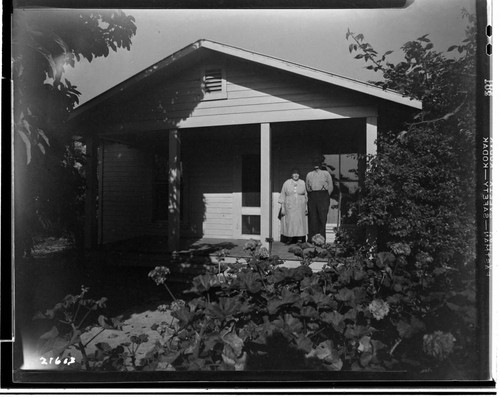 Mr. and Mrs. Pickens on porch