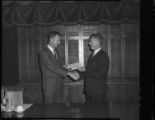 Men receiving Certificates of Completion from Edison's Substation Operators School