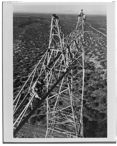 Working over 150 feet above the desert floor, an Edison crew assembles a tower for the Vincent-Lugo transmission line