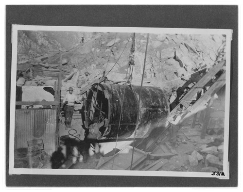 The penstock at the top of the hoist line about to be lowered into the tunnel at Kern River #1 Hydro Plant