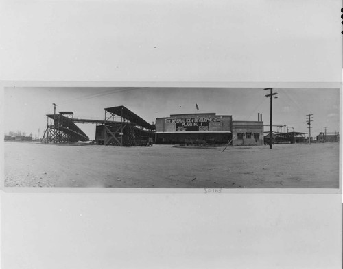 The Company's facilities at El Centro in 1918 included railroad car icing platforms (left), and ice plant (center), and a gas-engine powered generating plant and substation (extreme right)