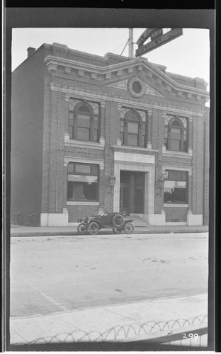 An automobile parked in front of the Visalia office building for the Mount Whitney Power and Electric Company