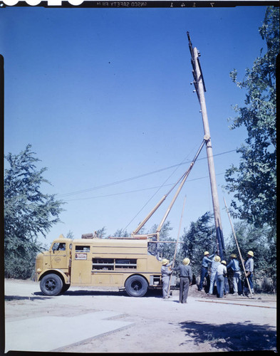 Pole placement with truck hoist