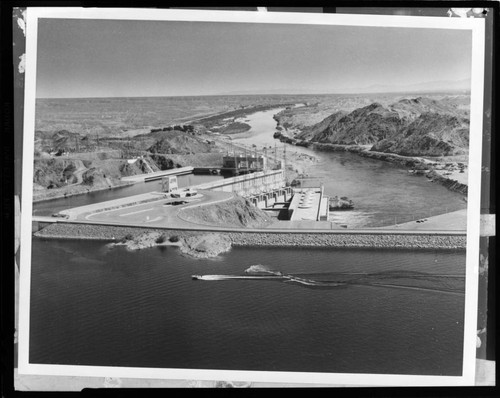 Marina on a lake, and a Hydro Plant below an earth-fill dam on what looks like the Colorado River