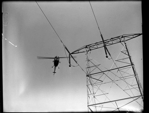 Helicopter patrolling Transmission Line