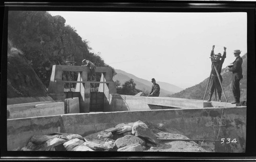 A team of surveyors checks the final alignment of the headworks of Kaweah #3 Hydro Plant in May 1914