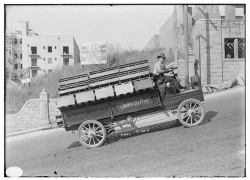 A man test driving the Lansden Electric truck on Grand Avenue in Los Angeles