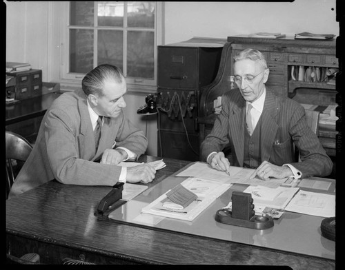 Two men at desk