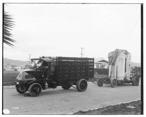 Mack Truck pulling 38kV transformers on a flat bed trailer (5 ton)