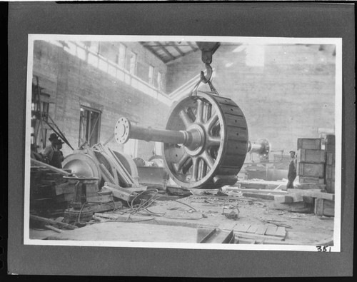 A construction crew mounting the rotor in the powerhouse at Kern River #1 Hydro Plant